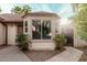 Exterior bay window with mature shrubs at 5121 W Jupiter Way, Chandler, AZ 85226