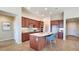 Kitchen island with seating and a double sink at 5407 W Windmill Ln, Eloy, AZ 85131