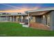 Covered patio with built-in planters and grassy backyard at 5429 E Bloomfield Rd, Scottsdale, AZ 85254