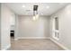 Modern dining area with stylish light fixture and tile flooring at 5429 E Bloomfield Rd, Scottsdale, AZ 85254