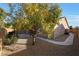 Landscaped backyard with a tree and pathway at 5450 W Taro Ln, Glendale, AZ 85308