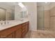 Modern bathroom with double vanity and walk-in shower at 5450 W Taro Ln, Glendale, AZ 85308