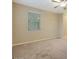 Well-lit bedroom with window and neutral wall colors at 5450 W Taro Ln, Glendale, AZ 85308