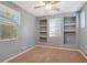 Bright bedroom featuring built-in shelves and window at 5450 W Taro Ln, Glendale, AZ 85308