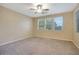 Spacious bedroom with neutral carpeting and large windows at 5450 W Taro Ln, Glendale, AZ 85308