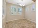 Charming dining room with chandelier and window shutters at 5450 W Taro Ln, Glendale, AZ 85308