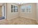 Bright dining room with tile floor and neutral wall colors at 5450 W Taro Ln, Glendale, AZ 85308