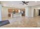 Open and bright Gathering room with tile flooring and fireplace at 5450 W Taro Ln, Glendale, AZ 85308