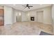 Light and airy Gathering room with tile flooring and a gas fireplace at 5450 W Taro Ln, Glendale, AZ 85308