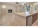 Open concept kitchen with island, breakfast bar, and adjacent Gathering room at 5450 W Taro Ln, Glendale, AZ 85308