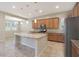 Modern kitchen with island, stainless steel appliances, and ample cabinet space at 5450 W Taro Ln, Glendale, AZ 85308