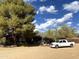 Rustic log home with covered porch and truck in a spacious yard at 5638 E Skinner Dr, Cave Creek, AZ 85331