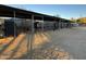 Multiple horse stables with covered areas and feeding troughs at 5638 E Skinner Dr, Cave Creek, AZ 85331