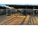 Two horses in individual stables under covered shelter at 5638 E Skinner Dr, Cave Creek, AZ 85331