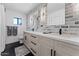 Modern bathroom with double sinks and a brick feature wall at 5717 E Justine Rd, Scottsdale, AZ 85254