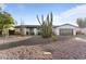 Modern home exterior with a clean design and desert landscaping at 5717 E Justine Rd, Scottsdale, AZ 85254