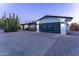 Modern home exterior with a clean design and a two-car garage at 5717 E Justine Rd, Scottsdale, AZ 85254