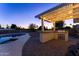 Covered patio features an outdoor kitchen with built-in grill at 5717 E Justine Rd, Scottsdale, AZ 85254