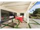 Outdoor patio with seating area and view into the living room at 5717 E Justine Rd, Scottsdale, AZ 85254