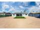 Large backyard with artificial turf and a gray house at 5927 W Mulberry Dr, Phoenix, AZ 85033