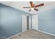 Spacious bedroom with ceiling fan and closet at 5927 W Mulberry Dr, Phoenix, AZ 85033