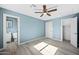 Bright bedroom featuring ceiling fan and new flooring at 5927 W Mulberry Dr, Phoenix, AZ 85033