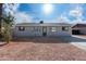 Newly renovated single story home with gray exterior and a landscaped front yard at 5927 W Mulberry Dr, Phoenix, AZ 85033