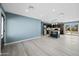 Modern kitchen with dark cabinets, marble countertops, and island at 5927 W Mulberry Dr, Phoenix, AZ 85033