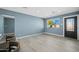 Living room with light wood floors, blue walls, and an entryway at 5927 W Mulberry Dr, Phoenix, AZ 85033