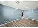 Simple living room with hardwood floors and light walls at 5927 W Mulberry Dr, Phoenix, AZ 85033