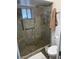 Large walk-in shower with glass enclosure and built-in seat at 5929 E Duncan St, Mesa, AZ 85205