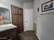 Bathroom with a vanity, storage cabinets, and wood flooring at 650 N Hawes Rd # 3431, Mesa, AZ 85207