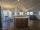 Open kitchen with breakfast bar and view into the living area at 650 N Hawes Rd # 3431, Mesa, AZ 85207