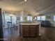 Kitchen with breakfast bar, island, and view into living room at 650 N Hawes Rd # 3431, Mesa, AZ 85207