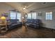 Bright living room featuring leather recliners and lots of natural light at 650 N Hawes Rd # 3431, Mesa, AZ 85207