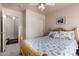 Bedroom with a floral comforter and ceiling fan at 660 N Maple St, Chandler, AZ 85226