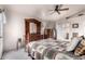 Bright bedroom with a wooden bed frame and access to a private bathroom at 660 N Maple St, Chandler, AZ 85226