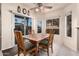 Bright dining area with wood table and chairs, access to backyard at 660 N Maple St, Chandler, AZ 85226