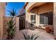 Front entry with a wooden gate and stone pathway at 660 N Maple St, Chandler, AZ 85226