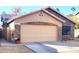 Tan house with stone accents and two-car garage at 660 N Maple St, Chandler, AZ 85226