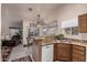 Kitchen with granite island, stainless steel appliances, and wood cabinets at 660 N Maple St, Chandler, AZ 85226