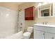 Clean bathroom with a tub, toilet and vanity at 6820 S Rita --, Tempe, AZ 85283