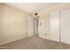 Spacious bedroom with carpeted floor and mirrored closet doors at 6820 S Rita --, Tempe, AZ 85283