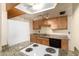 Well-equipped kitchen with granite counters and wood cabinets at 6820 S Rita --, Tempe, AZ 85283