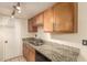 Kitchen boasts granite countertops and wood cabinetry at 6820 S Rita --, Tempe, AZ 85283