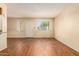 Living room features wood-look floors and a view of the front entrance at 6820 S Rita --, Tempe, AZ 85283