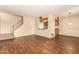 Bright living room with wood-look floors and a view of the kitchen at 6820 S Rita --, Tempe, AZ 85283