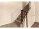 Carpeted staircase with metal railing leading to upper level at 6820 S Rita --, Tempe, AZ 85283