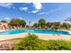 Relaxing kidney-shaped pool with surrounding landscaping and patio at 6820 S Rita --, Tempe, AZ 85283