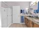 Elegant bathroom with double sinks, granite countertop, and a large shower at 6825 S Whetstone Pl, Chandler, AZ 85249